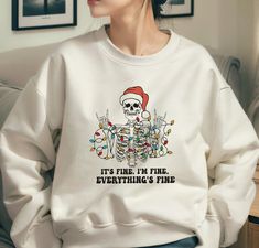 Please make sure you choose the right one from the hoodie - sweatshirt - t-shirt options. It's Fine I'm Fine Everything's Fine Christmas Skeleton Sweatshirt, Ugly Christmas Sweater Funny, Merry Creepmas,  Christmas Lights Sweaters ----------- How to Order Your Custom Design T-shirt ---------- * Choose your t-shirt color * Choose your size * PLEASE make sure all your order's steps Ideal for any situation, a unisex heavy blend crewneck sweatshirt is pure comfort. These garments are made from polye Merry Creepmas, Christmas Sweater Funny, Christmas Skeleton, Thanksgiving Sweater, Skeleton Sweatshirt, Birthday Sweatshirt, Ugly Christmas Sweater Funny, Trendy Sweaters, I'm Fine