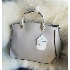 I Bought This Bag On Poshmark And Never Used It. Silver Satchel For Everyday Use, Classic Silver Bag For Everyday Use, Classic Silver Bag For Daily Use, Silver Large Capacity Crossbody Satchel, Silver Crossbody Satchel With Large Capacity, Large Capacity Silver Crossbody Satchel, Everyday Silver Satchel With Double Handle, Classic Silver Satchel For Everyday Use, Everyday Silver Double Handle Satchel