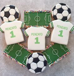 cookies decorated to look like soccer jerseys and balls