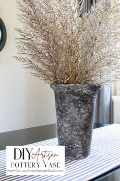 a potted plant sitting on top of a table in front of a wall clock