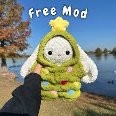 a person holding up a stuffed animal with the caption free mod