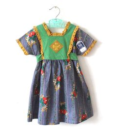 FRENCH VINTAGE 70's, stunning summer dress, long length, floral + polka dots cotton fabric, square collar, lace edgings, buttoned at the back ( flower buttons ), belt to tie. Size 2 years Length 19,6" / Waist ( taken flat ) 10,2" Size 5 years Length 25,6" / Waist ( taken flat ) 11,4" New old stock  I always refund overcharged shipping from 1 Euros overpaid ! Thank you for your visit Cute Vintage Dress With Lace Trim For Summer, Cute Summer Vintage Dress With Lace Trim, Cute Vintage Summer Dress With Lace Trim, Multicolor Cotton Dress With Lace Trim, Retro Cotton Vintage Dress With Vintage Pattern, Retro Cotton Dress With Vintage Pattern, Summer Vintage Dress With Lace Trim, Summer Cotton Prairie Peasant Dress, Summer Cotton Peasant Prairie Dress