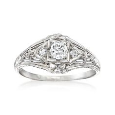 Ross-Simons - C. 1950 Vintage .36ct t. w. Diamond Filigree Ring Round Cut in 18kt White Gold. Size 7. C. 1950. From our Estate collection, this beautiful ring features a .30 carat round brilliant-cut diamond sparkling amid an elegant filigree design that hearkens back to its Retro-era origin. Finely crafted in polished 18kt white gold and dotted with round diamond accents. 3/8" wide. Diamond filigree ring. Exclusive, one-of-a-kind Estate Jewelry. Diamond birthstones are the perfect gift for Apri Classic Filigree Ring With 17 Jewels For Wedding, Classic Collectible Diamond Ring With Center Stone, Classic Collectible Cluster Ring With Diamond Cut, Classic Platinum Diamond Ring Collectible, Art Deco Diamond Ring With 17 Jewels For Anniversary, Vintage Platinum Diamond Ring For Formal Occasions, Vintage Platinum Diamond Ring For Formal Events, Vintage Single Cut Diamond Ring For Formal Events, Vintage Single Cut Diamond Ring For Formal Occasions