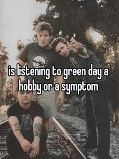 two men standing next to each other on train tracks with the caption is listening to green day a hobby or a symptm