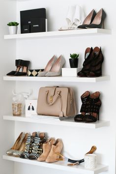 the shelves are filled with shoes and purses