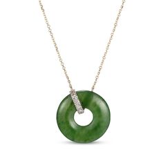 Traditional with a modern element, this nephrite jade and diamond necklace is a wondrous addition to her repertoire. Crafted in 14K yellow gold The pendant features a donut-shaped nephrite jade suspended in a jaunty loop of round-cut diamonds Total diamond weight is 1/15 carat The pendant suspends centered along an adjustable 18-inch cable chain that secures with a spring ring clasp Donut Necklace, Jade Charm, Donut Shape, Gems Art, Nephrite Jade, Jade Necklace, Jade Ring, Fish Shapes, Jade Jewelry