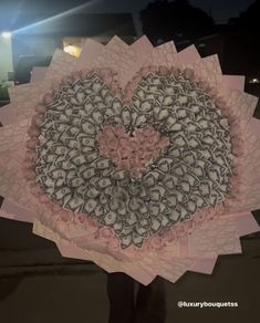 a heart shaped piece of paper on top of a table