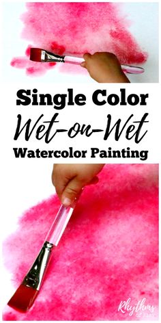 someone using a brush to paint pink watercolor