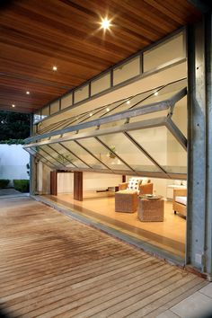 the inside of a modern house with wood flooring