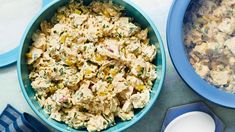 two bowls filled with food sitting on top of a table