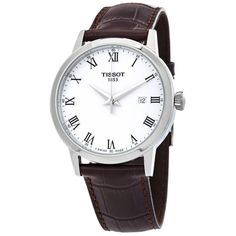 The Tissot T-Classic Quartz White Dial brings elegant dress style to your daily life. Premium 316L stainless steel crafts a timeless 42mm case paired with a brown leather strap, perfect for any occasion. Stylish Roman numeral hour markers surround a subtle white dial, always keeping you on-schedule. Inside ticks a dependable Swiss quartz movement, including convenient date display. With 50m water resistance, this watch stays looking sophisticated wherever your day leads. Capture every moment in White Leather Watch With Analog Display, White Leather Watch Accessories With Metal Dial, White Leather Analog Watch, Classic White Leather Watch Accessories, Classic White Watch With Leather Strap, White Leather Strap Watch For Business, White Leather Strap Business Watch, Classic White Leather Watch, White Leather Watch With Date Indicator