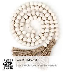 white beads with tassels are shown on a white background and the words item id um