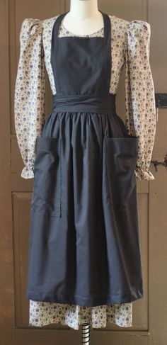 a mannequin wearing an apron and dress