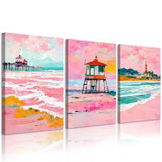 three pieces of art with pink and yellow colors on the beach, one has a light house