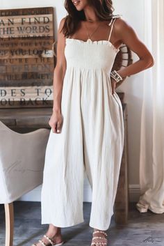 Elluis - Comfortable Jumpsuit with Spaghetti Straps, High Waist, and Flowing Design Beige Stretch Jumpsuits And Rompers For Summer, White Casual Strapless Jumpsuit For Summer, White Strapless Casual Jumpsuit For Summer, Casual White Strapless Jumpsuit For Summer, Casual Sleeveless Cream Jumpsuits And Rompers, White Fitted Casual Strapless Jumpsuit, White Casual Strapless Jumpsuit For Beach, Summer Cream Overall Jumpsuits And Rompers, White Stretch Strapless Jumpsuit For Spring