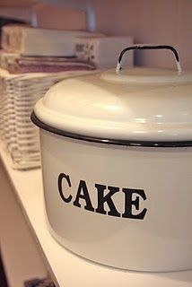 a large white cake dish sitting on top of a counter