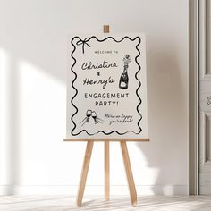 an easel with a sign that says welcome to charlotte henry's engagement party