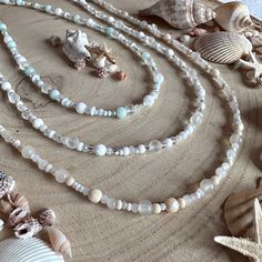 Beaded necklaces with a delicate summery, beachy, seaside vibe! Not your average beaded necklace, these designs consist of a multitude of beads, in varying sizes, shapes and complimentary tones. I use glass, ceramic, stone and gemstone beads in my necklaces, each design will feature a variety of these.  Style One: Pale sand and pearly shell vibes! Style Two: White and sparkling glass bubble shades Style Three: Delicate aqua with a sea glass feel Check out my other listings for more colours and s Bohemian Beach Necklace With Faceted Beads, Summer Beach Beaded Necklaces With Gemstone Beads, Bohemian Necklace With Faceted Beads For Beach, Bohemian Necklaces With Faceted Beads For Beach, Bohemian Crystal Necklace With Faceted Beads For Beach, Bohemian Crystal Necklaces With Faceted Beads For Beach, Beach Single Strand Beaded Bracelet With Round Beads, Beach Single Strand Beaded Bracelets, Single Strand Beaded Bracelets With Round Beads For Beach