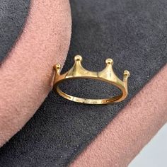 14K Solid Gold King Crown Ring ✨👑 Product Features Weight: 1.35 Gr ⚖️ Material Color: Yellow Gold, Rose Gold, and White Gold 🌈 Presentation: Shipped with a special box and bag 🎁 Returns: Right to return within 7 days 🔄 Material and Color: Product color does not fade or darken ✨ Handcraftsmanship and Uniqueness: Handcrafted and may vary by 5% (+-) 🛠️ Product Description Embrace regal elegance with the 14K Solid Gold King Crown Ring. This exquisite ring, weighing 1.35 grams, is available in three stunning colors: Yellow Gold, Rose Gold, and White Gold, offering a choice to match your personal style 🌈. Crafted with meticulous attention to detail, the King Crown design symbolizes power and majesty. Each piece is handcrafted, ensuring unique characteristics with a slight variation of 5% ( Yellow Gold Diamond Ring With Crown Design As Gift, Rose Gold Ring With Crown Design, Classic Crown Promise Ring, Classic Crown Shaped Promise Ring, Crown Shaped Fine Jewelry Rings For Gifts, Yellow Gold Crown Rings Fine Jewelry, Gold Crown Ring, Rose Gold Crown Design Ring As Gift, Open Ring With Crown Design For Promise