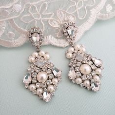 Hollywood Glam crystal earrings, made with top Swarovski rhinestones hand sett on silver filigree drop . finished with hypo allergenic surgical steal ear wire. Original design , hand crafted by me in my studio. Light weigh and very comfortable to wear . Matching necklace at this link: https://www.etsy.com/listing/1069151729/bridal-crystal-necklace-vintage-style?ref=shop_home_active_1&frs=1 Please contact me if you have any questions. Vintage Bridal Earrings, Bridal Shoes Vintage, Vintage Bridal Hair, Crystal Wedding Necklace, Blue Bridal Earrings, Blush Earrings, White Opal Earrings, Crystal Earrings Wedding, Crystal Bridal Earrings