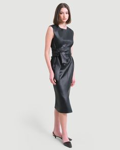 A sleek and modernized take on the LBD — this vegan leather dress is perfect for the office layered over a long-sleeve tee or on its own for date night. See below for our general Size Guide and available measurements Made of polyester, lining made of polyester Machine wash cold separately, tumble dry at low temperature, cool iron as needed Leather Midi Dress For Work, Sleek Leather Workwear Dress, Sleek Leather Dresses For Workwear, Sleek Leather Dress For Work, Sleek Office Dresses For Fall, Chic Leather Workwear Dress, Leather Midi Dress For Date Night, Chic Leather Midi Dress For Date Night, Black Leather Office Dress