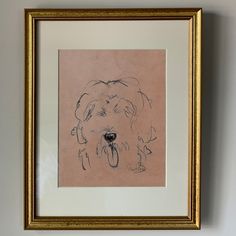 a drawing of a dog is hanging on the wall