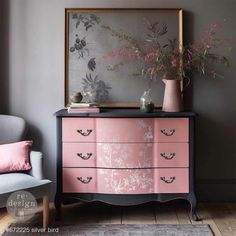 a pink and black dresser with flowers on it