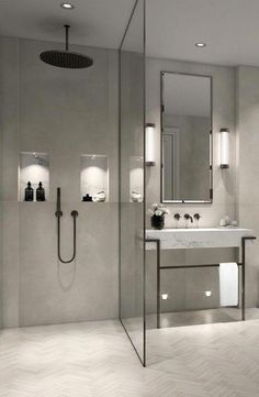 a bathroom with a sink, mirror and shower head in the middle of the room