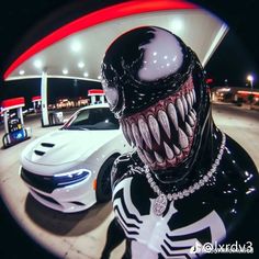 a car and a spider man in front of a gas station