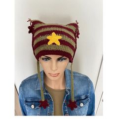 a mannequin head wearing a knitted hat