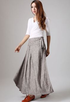 "The Wrap skirt tie by the side string. another side inner open by three buttons. The linen skirt has two side pockets. The wrap linen skirt has a Irregular hem, two different side. DETAIL * The fabric is a medium-weight sturdy linen-cotton blend. it is Environmentally friendly, breathable, comfortable, good drape, comfortable to wear, etc. * Lovely full, length wrap around skirt, the length is fun for flipflops and heels. * wrap-around fastens on side at hip with three buttons inside, then is t Ageless Style Aging Gracefully, Long Wool Skirt, Dark Grey Skirt, Linen Wrap Skirt, Maxi Wrap Skirt, Long Wrap Skirt, Skirt Linen, Tailored Clothes, Skirt Wrap