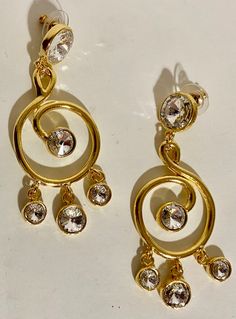 Vintage gold pierced swirl dangles  Austrian cut crystal  rivoli's Beautiful Norma jean clip gold finish  earrings They are in  new condition, Norma Jean is known for high quality  and these are well made! Made in the USA Please do not hesitate to get in touch with me with any questions Please take a look at all my items on Etsy  Watch as  there are new items listed almost daily! Matte Gold Earrings, Norma Jean, Gold Clips, Vintage Heart, Stunning Earrings, Drop Earring, Designer Earrings, Earings Piercings, Crystal Earrings