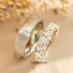 two gold wedding rings with diamonds on them