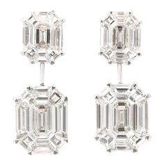 These earrings give the illusion of 5-6 carat EACH emerald cut drops! 5.02 carats of F VS special cut diamonds, masterly set to look like one emerald cut diamond. Set in 18k white gold .90 inch length. A wearable pair of earrings, full of sparkle! Emerald Cut Drop Earrings, Elegant Pendant, Diamond Drops, Diamond Drop Earrings, Emerald Cut Diamonds, Drop Earring, Modern Earrings, Yellow Diamond, Emerald Diamond