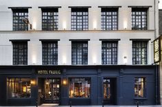 the hotel franic in new york city is lit up at night with bright lights