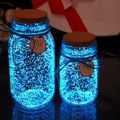 two mason jars with tags on them sitting on a table next to each other and the words holiday joy is happening on ebay