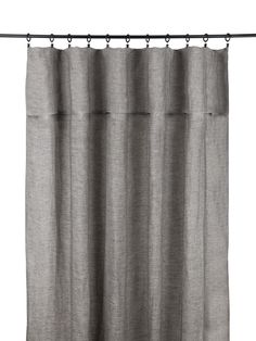 a gray curtain hanging on a metal rod