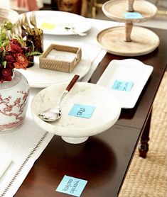 the table is set with dishes and place settings for guests to enjoy their own meal