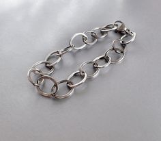 "Large link flat cable minimalist sterling silver women's bracelet. Large chunky oval links are flat, substantial, but lightweight, and bracelet is very comfortable to wear. Each link measures about ½ inch x 3/8 inch. Large teardrop lobster clasp hooks onto the end of the chain. Choose your length: 6, 6 ½, 7, 7 ½, 8, 8 ½, 9 inches. This is the actual measurement of the bracelet. Length may be as much as ¼ inch off because the super long links makes it hard to be accurate. Designed for women. Min Everyday Chunky Oval Link Bracelets, Modern Chunky Oval Link Bracelets, Modern Sterling Silver Bracelet With Rolo Chain, Womens Sterling Silver Bracelets, Sterling Silver Bracelet, Etsy Shipping, Tiffany Heart, Heart Charm Bracelet, Chain Link Bracelet