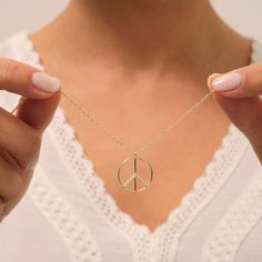 Your Gold Peace Necklace is stylish, dainty and pretty ideal for everyday use. Details of solid gold handmade Sign of Peace Jewelry are very eye-catching. It is a great gift for your loved ones. This jewelry will be an indispensable piece of yours. This meaningful World Peace Charm with high quality handwork will be a legacy you can leave to your family its.  * Peace Necklace Details * Material / Gold Kt : This elegant necklace is made of 14k and 18k Solid Gold * Available Gold Colors : Yellow Gold, White Gold, Rose Gold * Pendant Length : 1.70 cm * Pendant Width : 1.70 cm * Chain Length Options :  - 14 Inches - 35,56 cm - 15 Inches - 38,10 cm - 16 Inches - 40,64 cm - 17 Inches - 43,18 cm - 18 Inches - 45,72 cm - 19 Inches - 48,26 cm - 20 Inches - 50,80 cm - 21 Inches - 53,34 cm - 22 Inche Simple Gold Necklace With Round Pendant, Gold Necklace With Simple Round Design, Simple Gold Round Necklace, Simple Gold Necklace With Round Shape, Simple Yellow Gold Necklace As Gift, Minimalist Recycled Gold Necklace As Gift, Minimalist Recycled Gold Necklace For Gift, Minimalist Recycled Gold Necklace Gift, Simple 14k Gold Necklaces