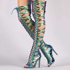 Step into the spotlight with our women's holographic peep-toe gladiator sandals. Featuring a thigh-high design, lace-up detailing, and a trendy snake embossed, these sandals are perfect for making a statement. Color: Green and blue Heel Type: stiletto heel Heel height: 4.72" / 120 mm approx Product measurements were taken using size 8. Please note that measurements may vary by size. Toe: Peep toe Lace-up design Snake embossed upper design Handcrafted US sizing. Fits true to size. Spring Club Knee-high Heels, Knee-high Heels For Spring Clubbing, Knee-high Heels For Club In Spring, Trendy Knee-high Summer Heels, Gladiator Boots, Lace Up Gladiator Sandals, Gladiator Sandals Heels, Gladiator Heels, Snakeskin Heels