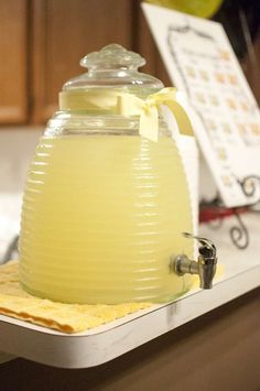 a yellow pitcher sitting on top of a counter