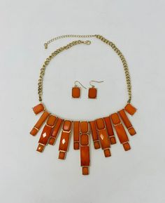 Don these beauties for your next glamour event! This orange and gold costume jewelry set is GORGEOUS! The necklace measures 21" long end to end x 3" top edge to bottom edge of the longest center pendant piece. The earrings measure .75" x .5" and are for pierced ears. What BEAUTIES! Retro Orange Jewelry For Party, Orange Costume Jewelry Necklace For Party, Vintage Orange Jewelry For Party, Orange Costume Jewelry For Formal Occasions, Retro Orange Jewelry For Formal Occasions, Retro Orange Jewelry For Formal Events, Orange Costume, Gold Costume Jewelry, Earrings Matching