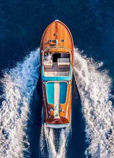 an aerial view of a motor boat in the water