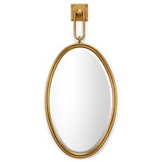 an oval mirror hanging on the wall with a gold frame and metal loop around it