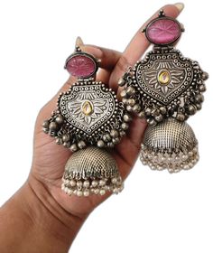 Temple Jewelry Metal Earrings With Tilla, Silver Fusion Style Jhumkas With Latkans, Silver Dual-tone Chandbali Earrings, Silver Fusion Jhumkas With Latkans, Silver Metal Jhumkas With Latkans, Silver Fusion Style Drop Jhumkas, Handmade Silver Metal Jhumkas, Handmade Silver Fusion Style Jhumkas, Silver Temple Jewelry Chandelier Earrings With Intricate Design