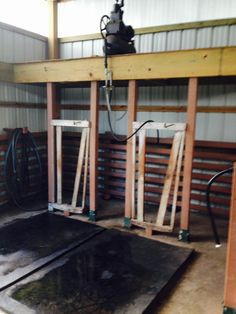 the inside of a building being worked on with wood pallets and metal flooring