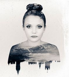 a black and white photo of a woman's face with clouds in the background