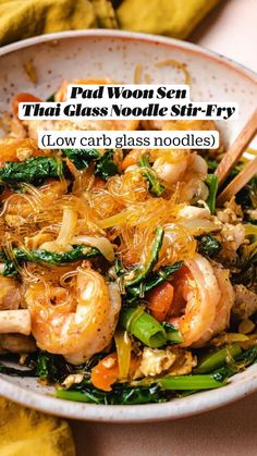 a close up of a bowl of food with chopsticks in it and the words pad woon see thai glass noodle stir fry