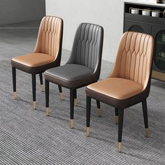 three chairs sitting on top of a carpeted floor